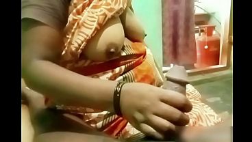 Watch Indian Aunty’s Hand Sliding Over A Young Boy’s Hard Cock